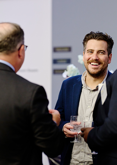 Two professional men engaged in conversation